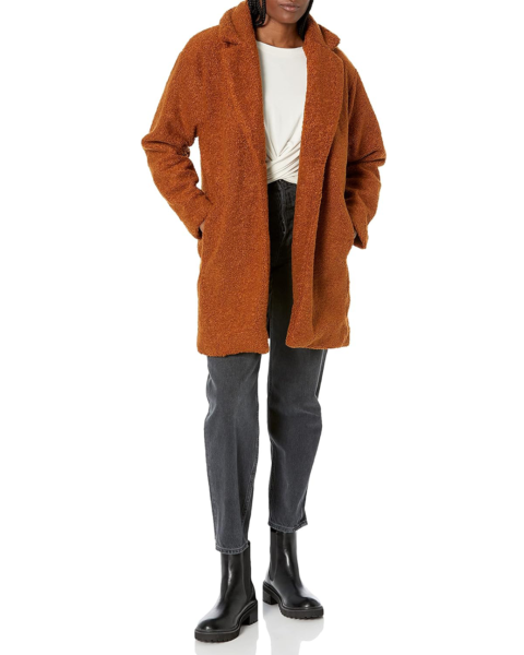 Model wearing a red fuzzy winter coat