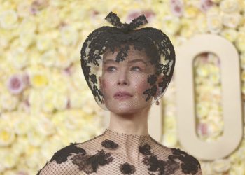 The Meaning Behind Rosamund Pike’s Golden Globes ‘Saltburn’ Look