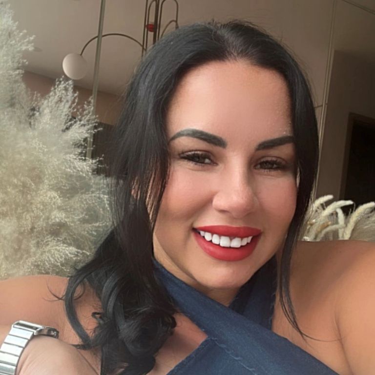 Woman smiling a screen