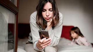 Mum looking at her phone