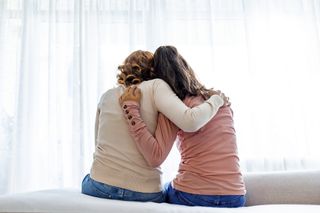 Mum supporting her teenage daughter through puberty