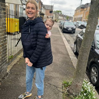 Our tester and editor, Anna Bailey, wears the Kowari Wombat & Co babywearing coat