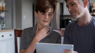 Dad talking to older son
