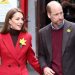 Kate Middleton braves the rain in fiery red coat and brown knit