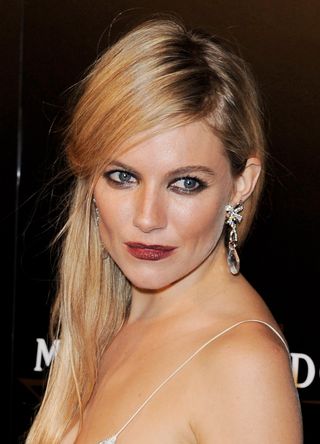 Sienna Miller arrives at the Moet & Chandon Etoile Award, honouring fashion photographer Mario Testino for his contribution to cultural society at the Park Lane Hotel on September 19, 2011 in London, England