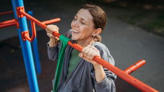Woman doing pull-up with resistance band