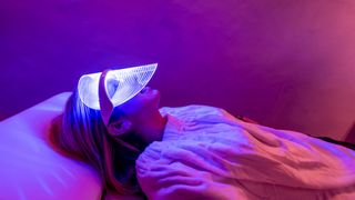 woman with LED mask on