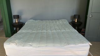 Floks Wool Mattress Topper on the bed