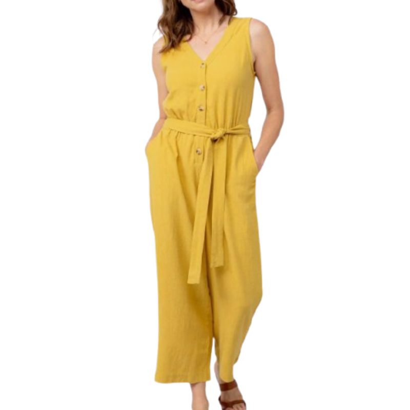 a model wearing a cropped length yellow jumpsuit 