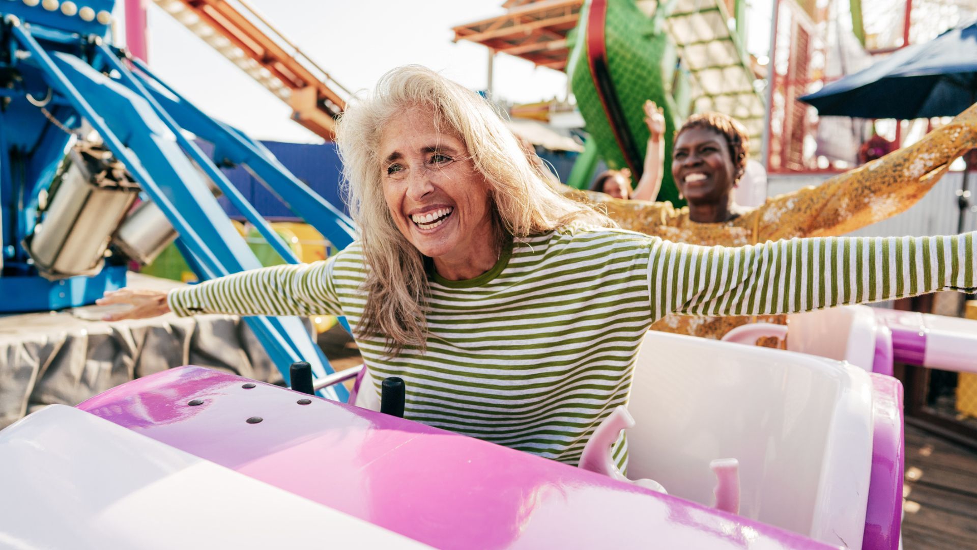 A woman enjoys a rollercoaster