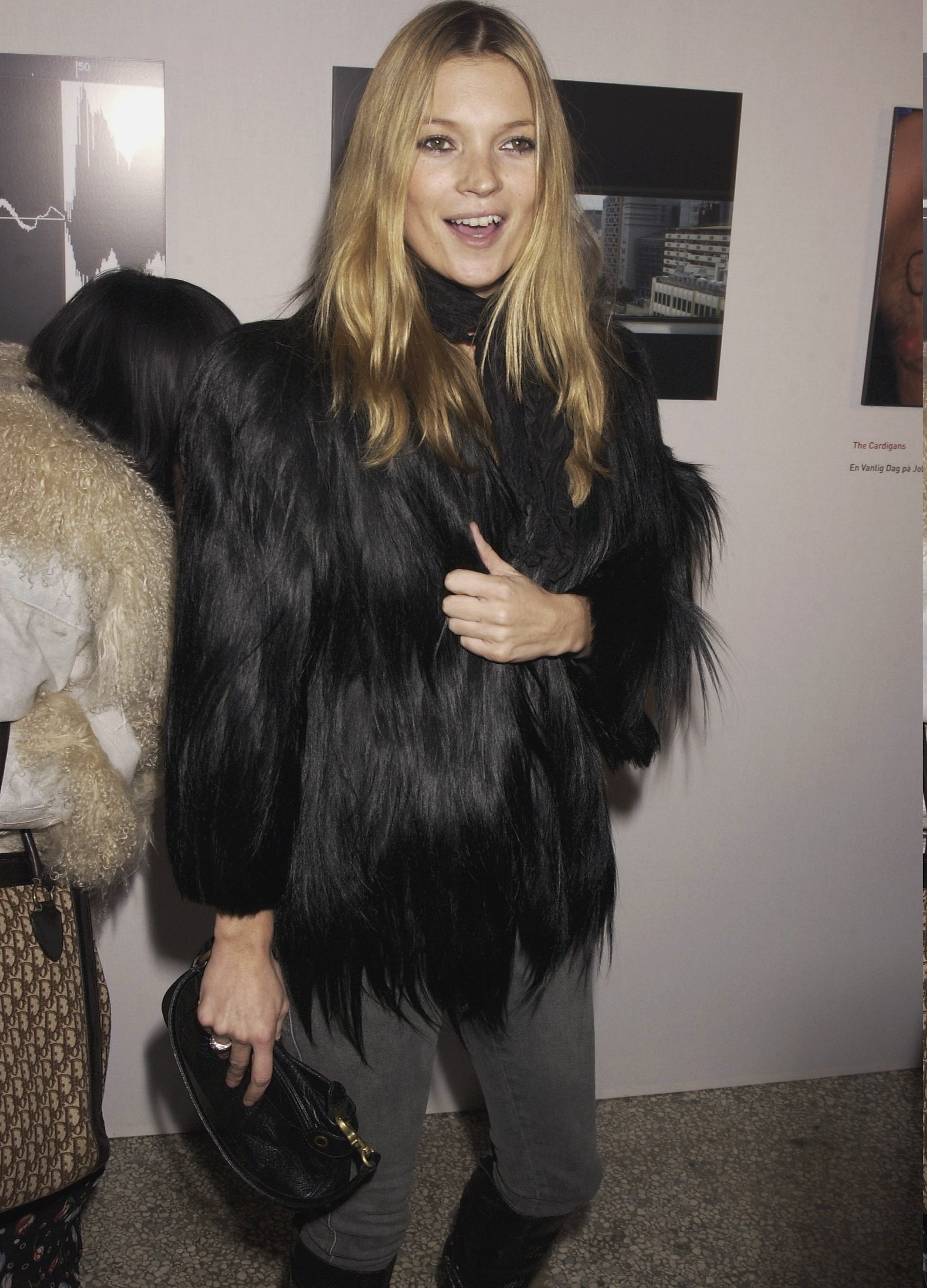 Kate Moss wearing black fur coat