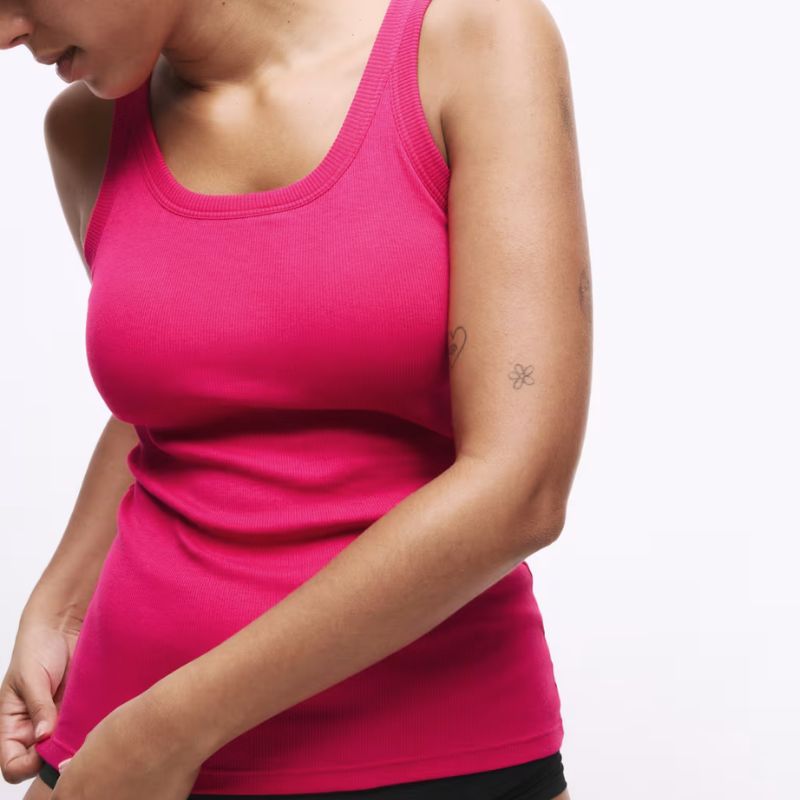A model wearing the M&S secret support vest in pink