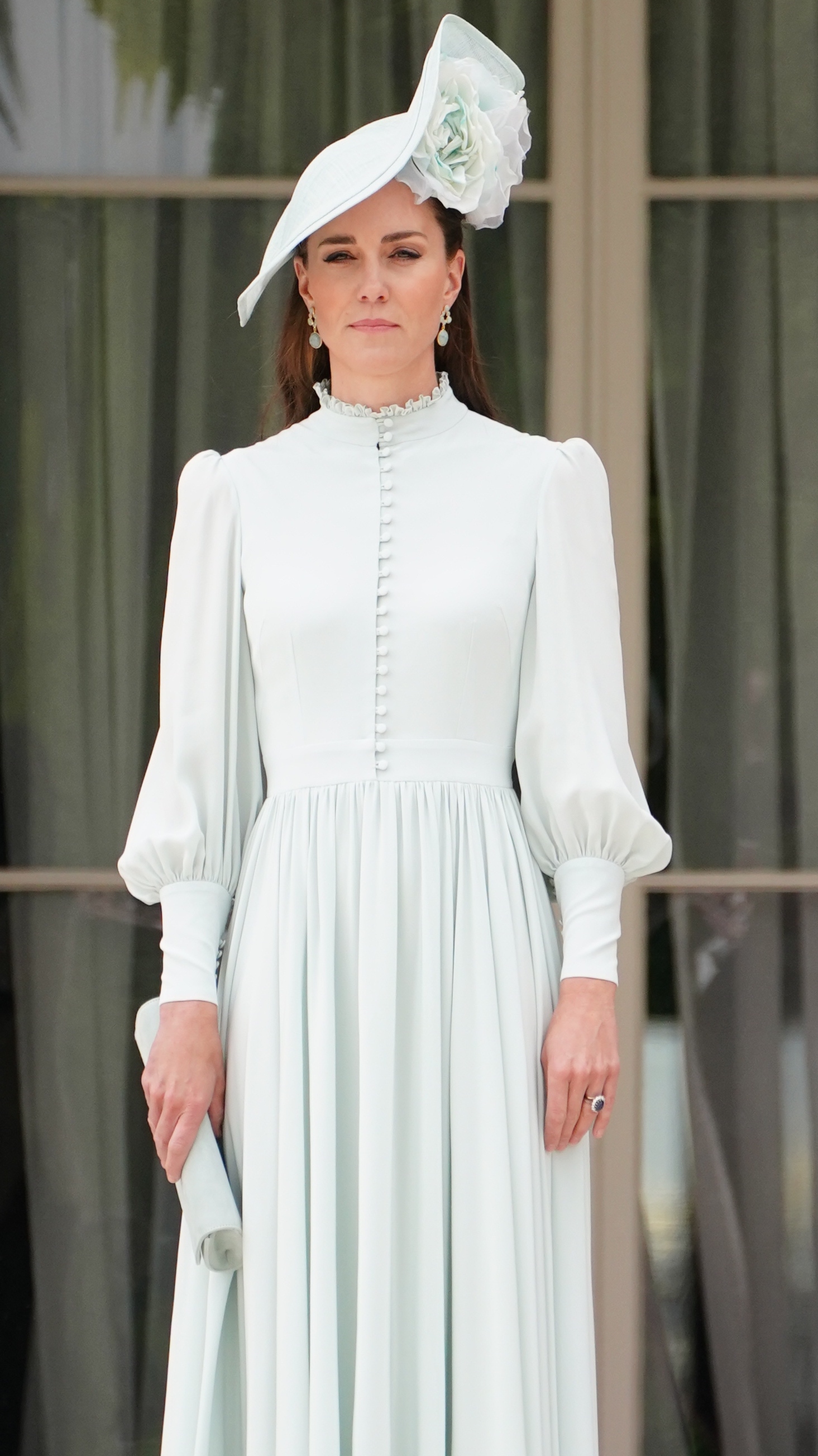 Catherine, Princess of Wales holds a clutch bag as she attends a Royal Garden Party at Buckingham Palace on May 25, 2022
