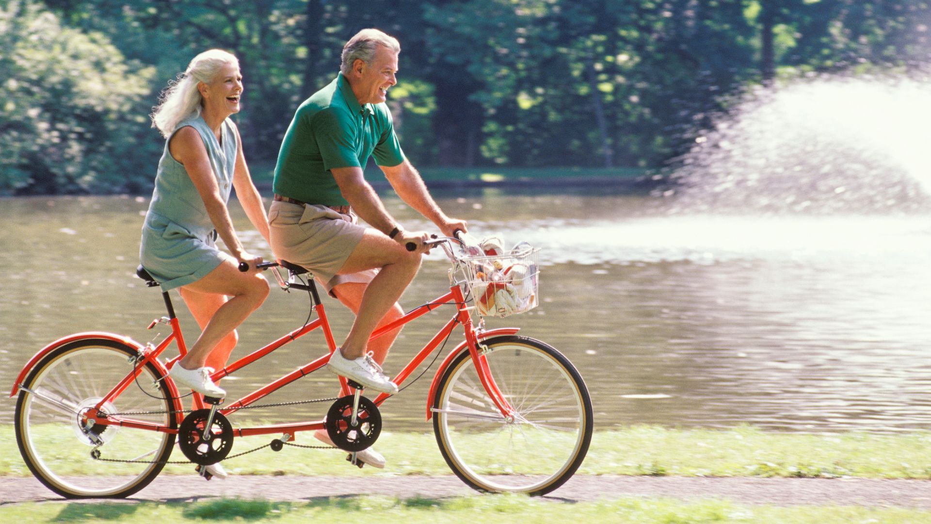 A couple on a tandem bike