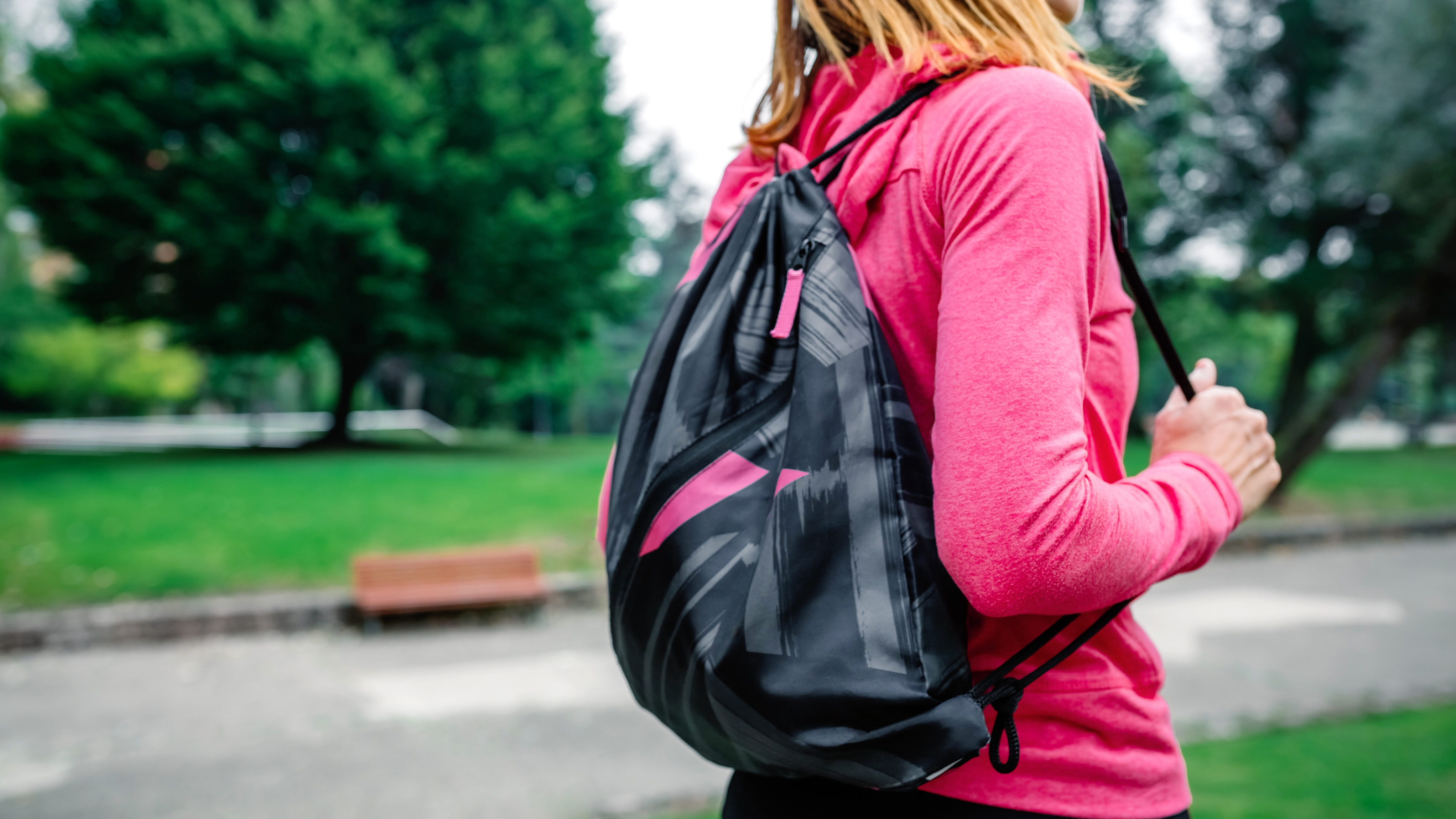 woman carrying gym bag