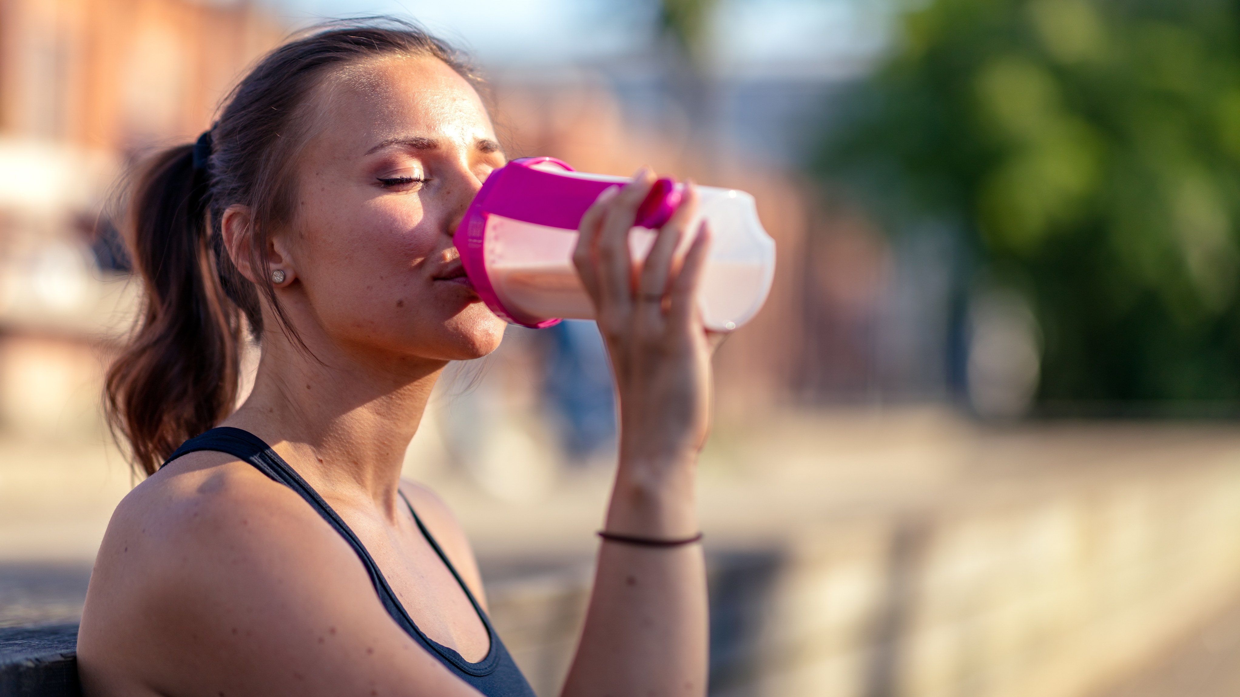 woman drinking protein shake