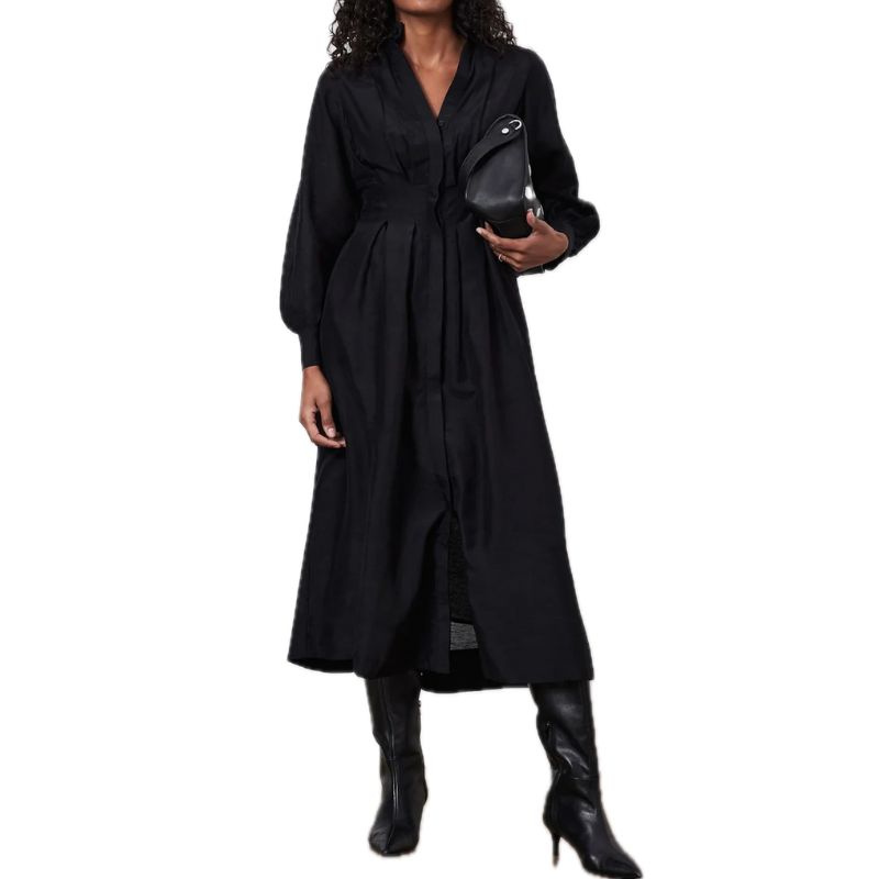 a model wearing a black shirt dress by mint velvet