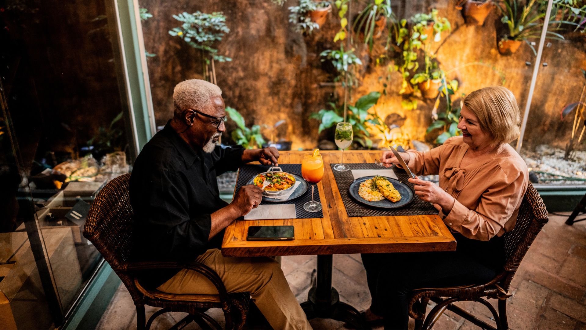 A couple dine in a private greenhouse