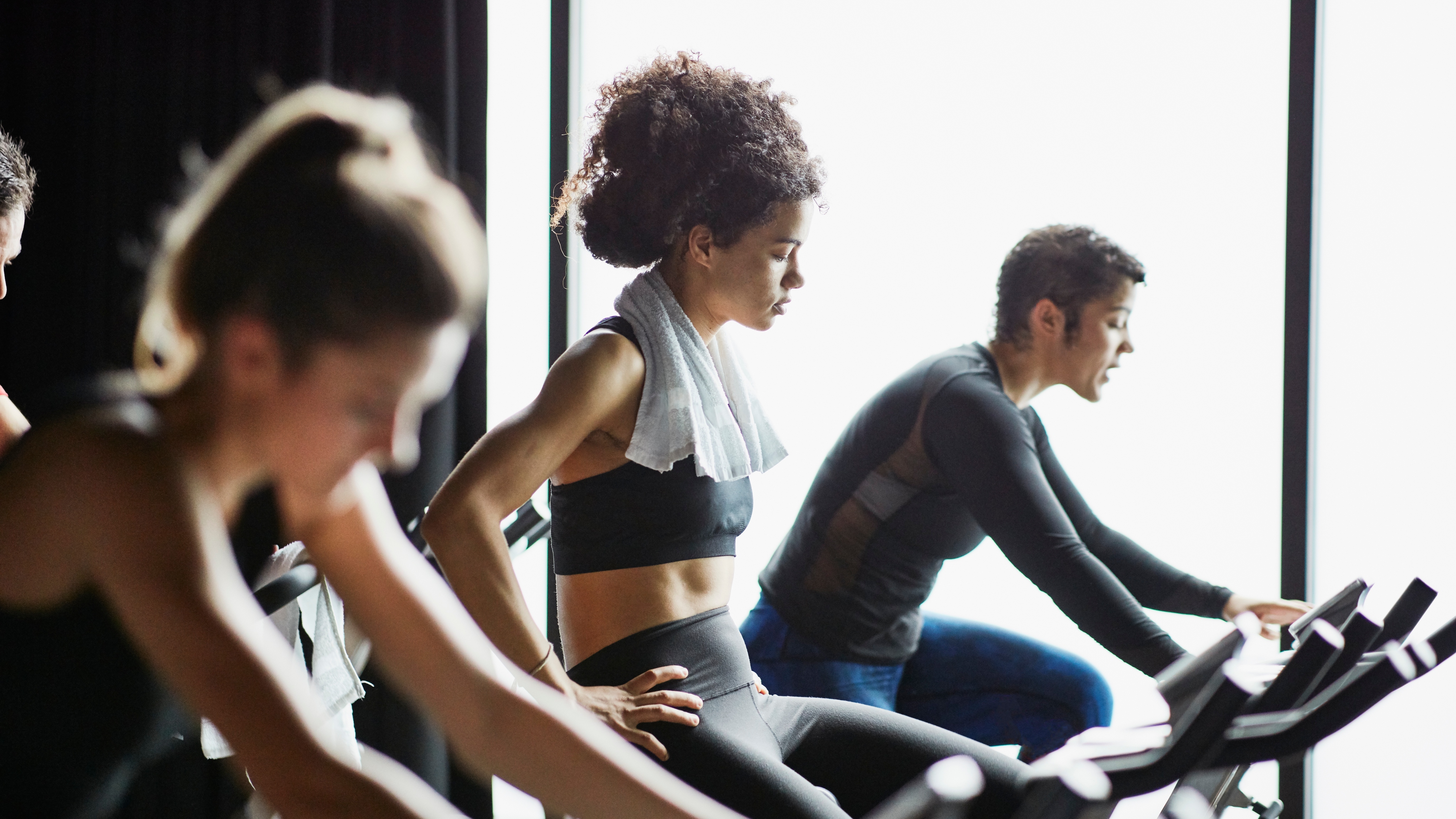 woman on spin bike at gym