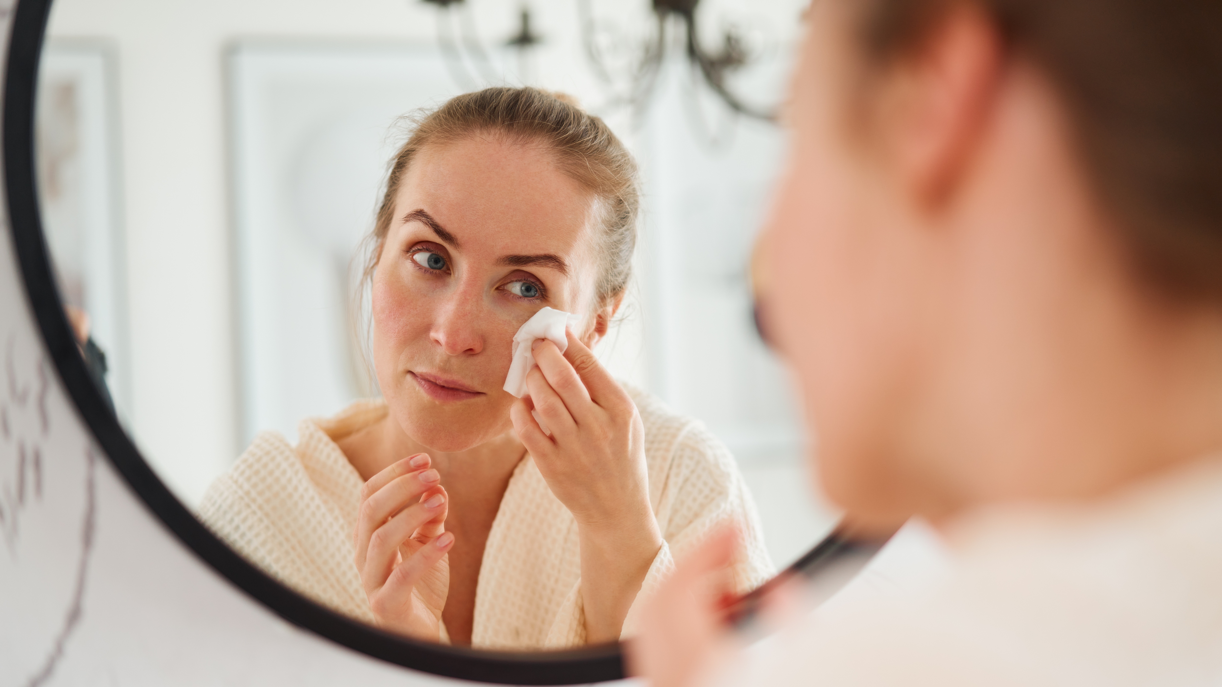 woman wiping face