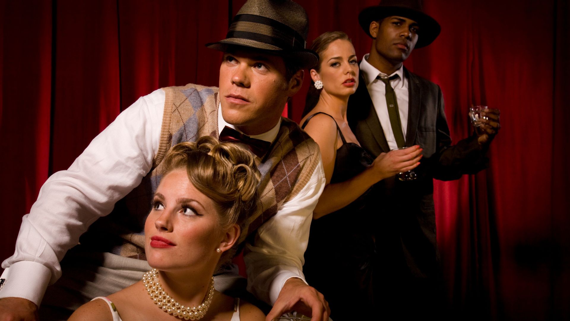 A group of actors in period costumes