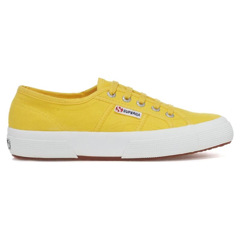 a bright yellow superga trainer