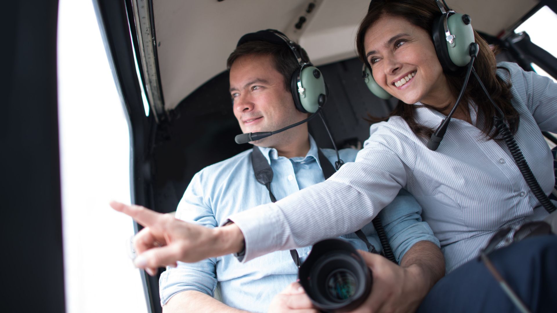A couple enjoy a helicopter ride