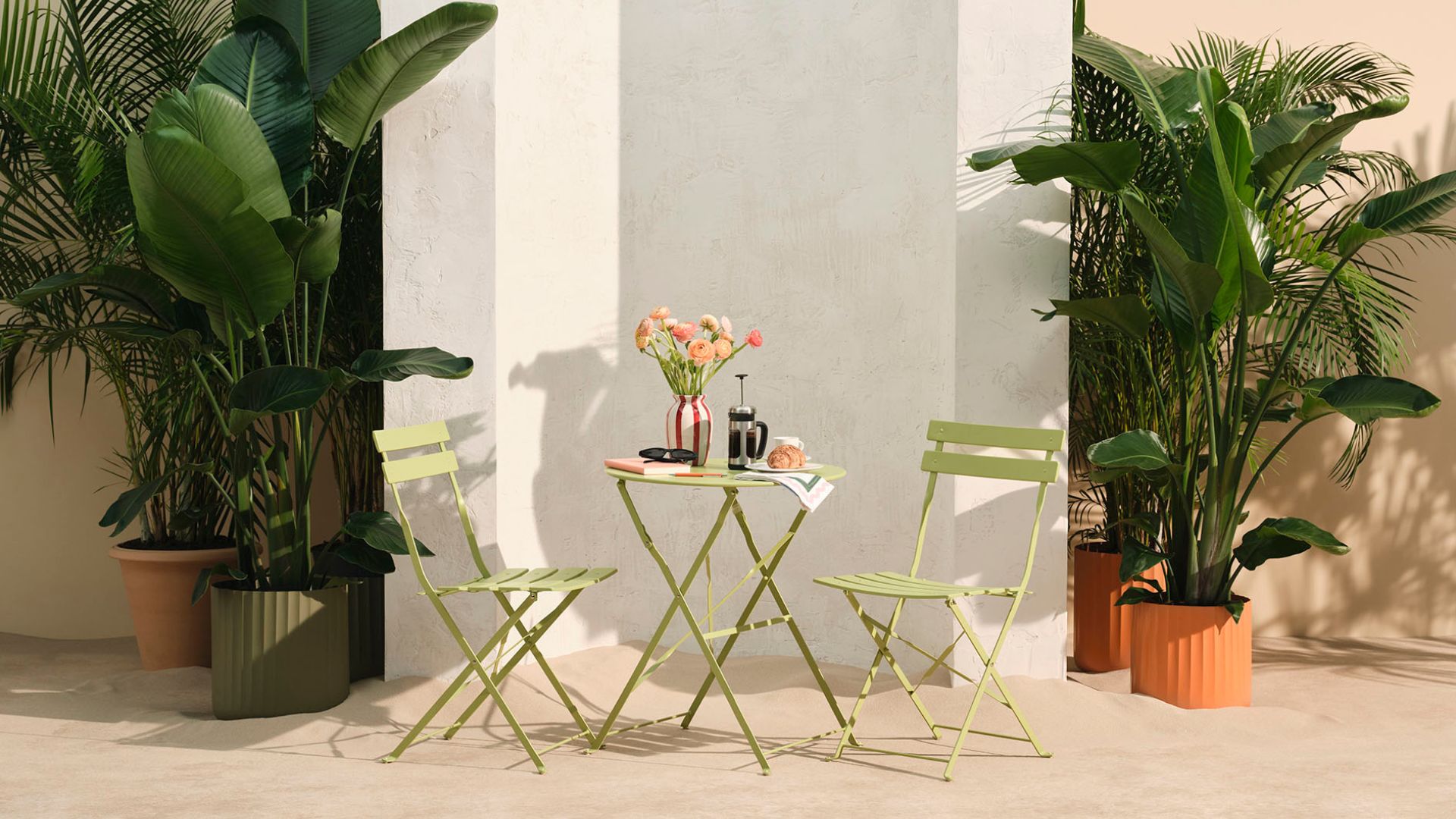A pistachio green outdoor bistro set