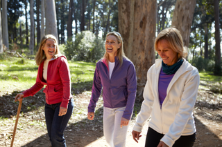 three women walking outside together