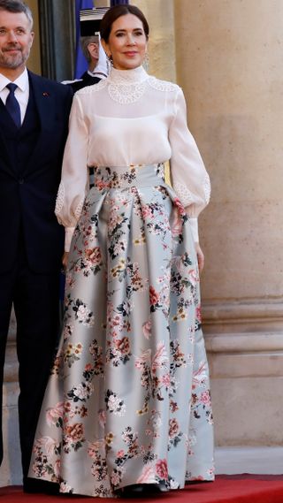 Queen Mary of Denmark stands outside the Elysee presidential palace
