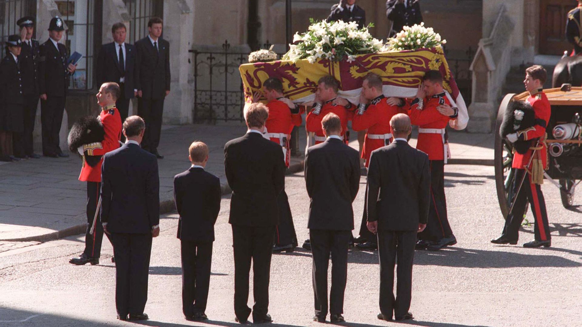 Princess Diana's coffin is carried into Westminster Abbey, observed by Charles, Harry, William, Charles Spencer, and Prince Philip