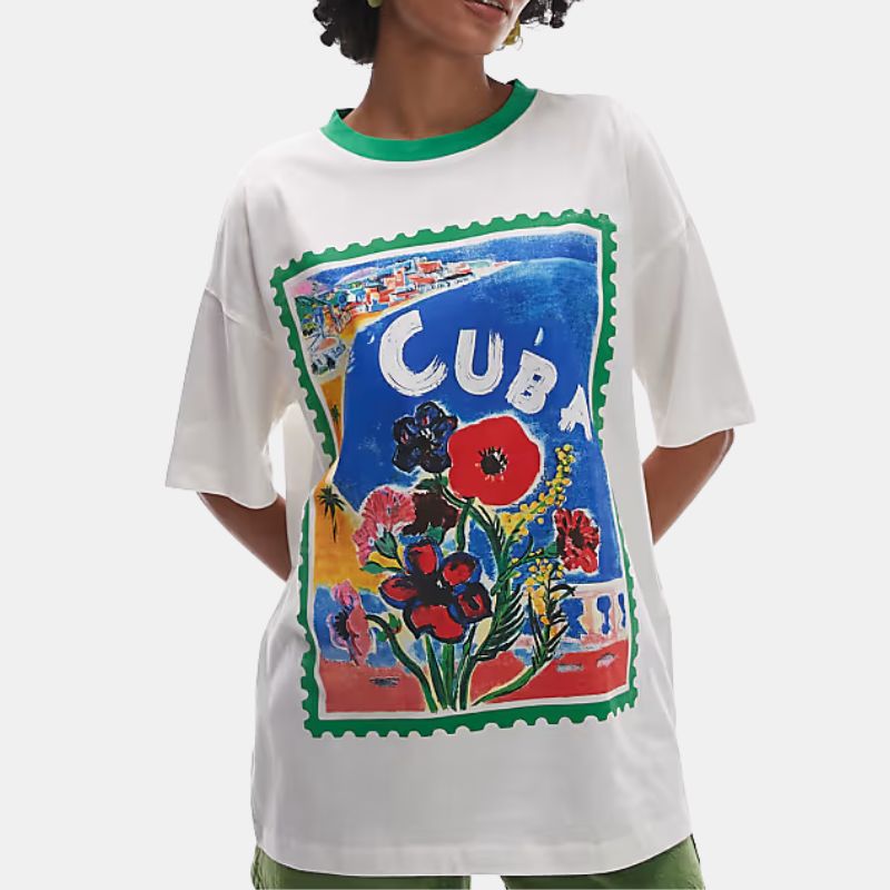 A model wears a brightly coloured graphic print t-shirt