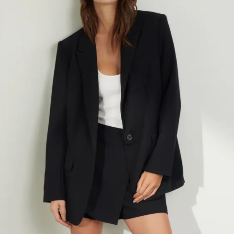 oversized black blazer with a boxy fit and single button