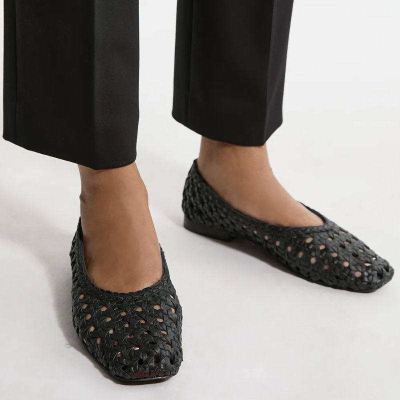 Image of black woven pumps