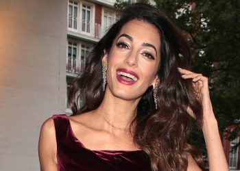 Amal Clooney’s burgundy jumpsuit is an ideal wedding guest outfit