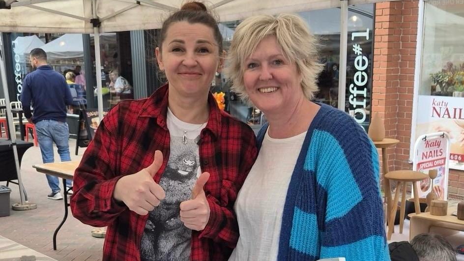 Svitlana and Kara on the cake stall
