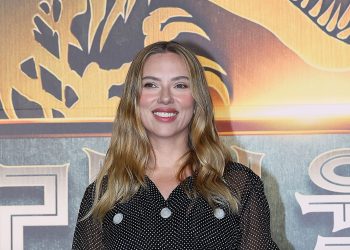 Scarlett Johansson wears a polka dot dress at the Jurassic World press conference