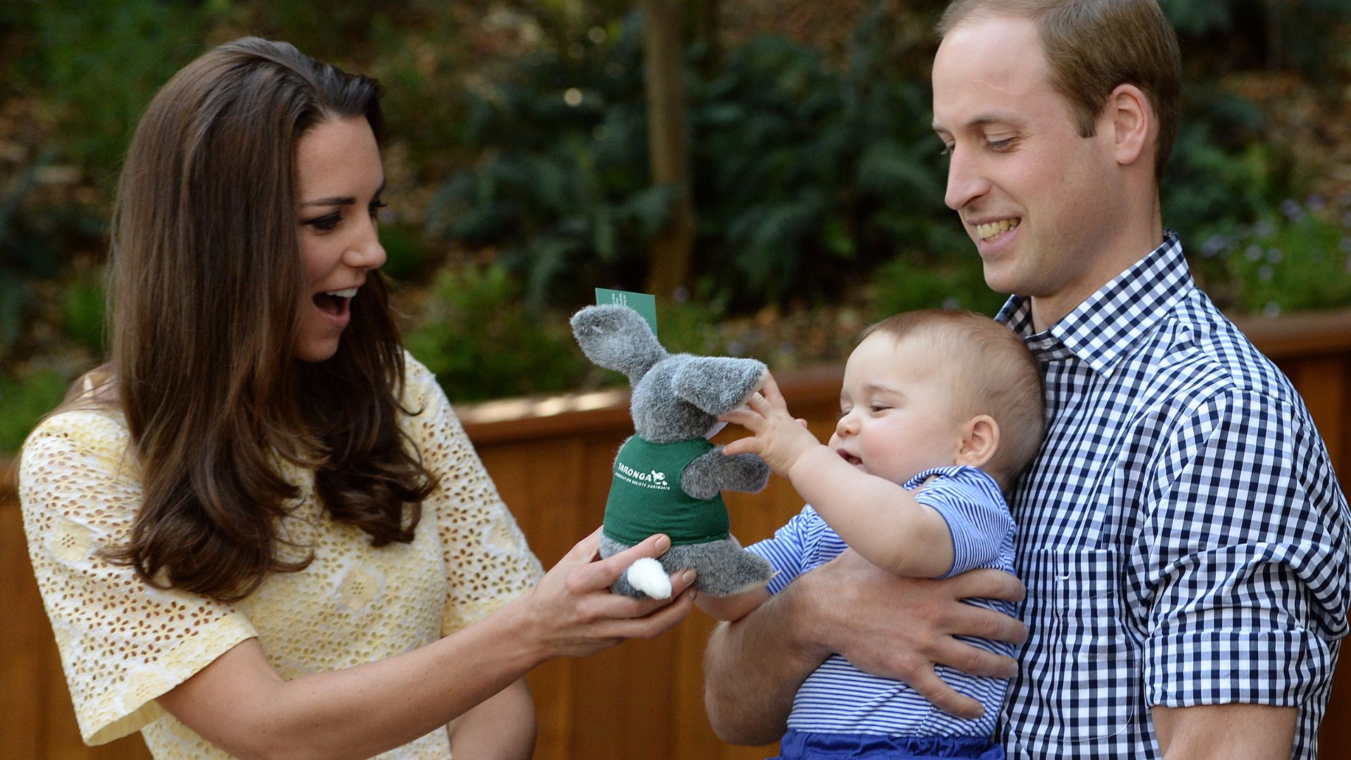 Kate Middleton and Prince William give a toy to Prince George in Australia