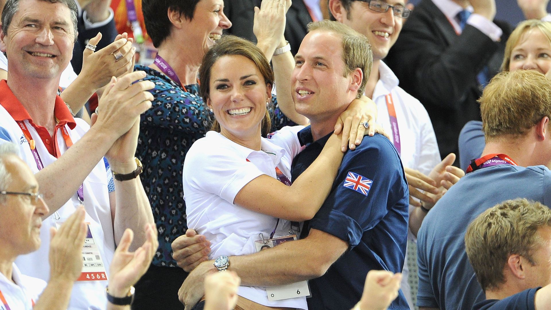 Kate Middleton and Prince William hug while watching the London 2012 Olympics
