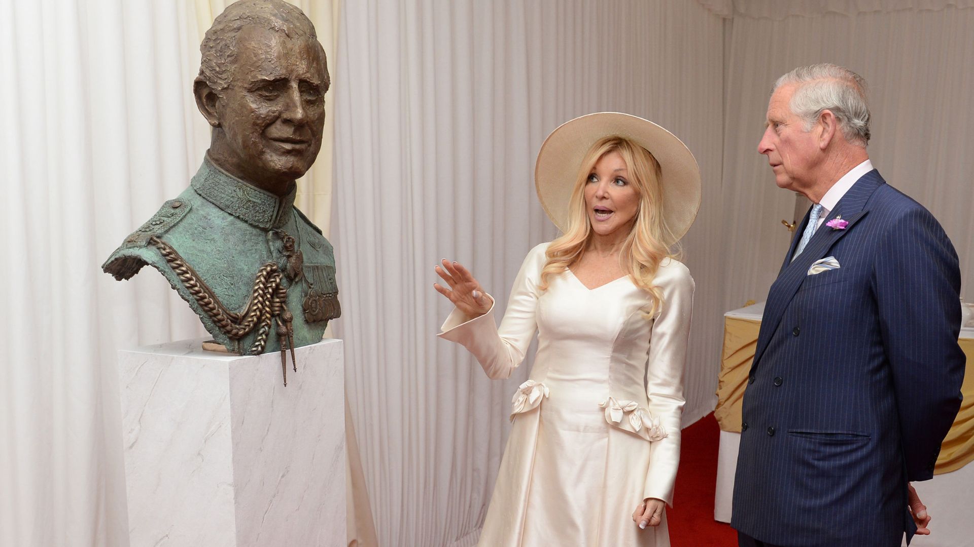 King Charles is shown a sculpture of himself, by the artist Frances Segelman, during a garden party to mark the 40th anniversary of The Prince&#039;s Trust charity in 2016