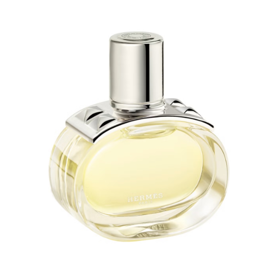 A product shot of the Hermès Barenia Eau de Parfum, which features a silver lid and is housed in a oval glass bottle - pictured on a white background