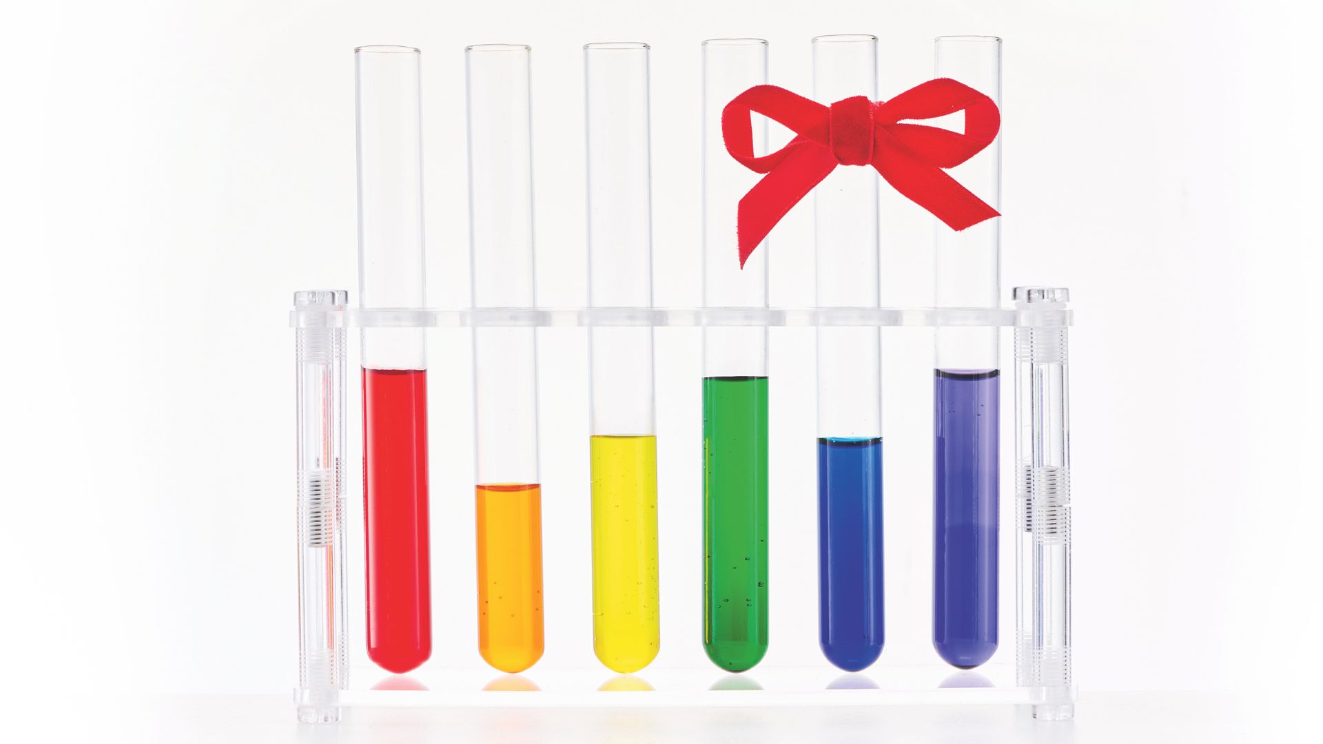 test tubes with different coloured liquids and a red ribbon