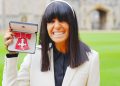 Claudia Winkleman collects her MBE in striking white suit