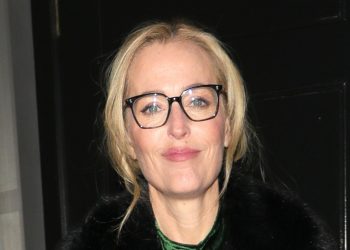 Gillian Anderson wears this season’s big velvet dress trend