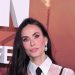 Demi Moore’s layered sheer blouse and strappy black dress combination is a genius styling trick for party season