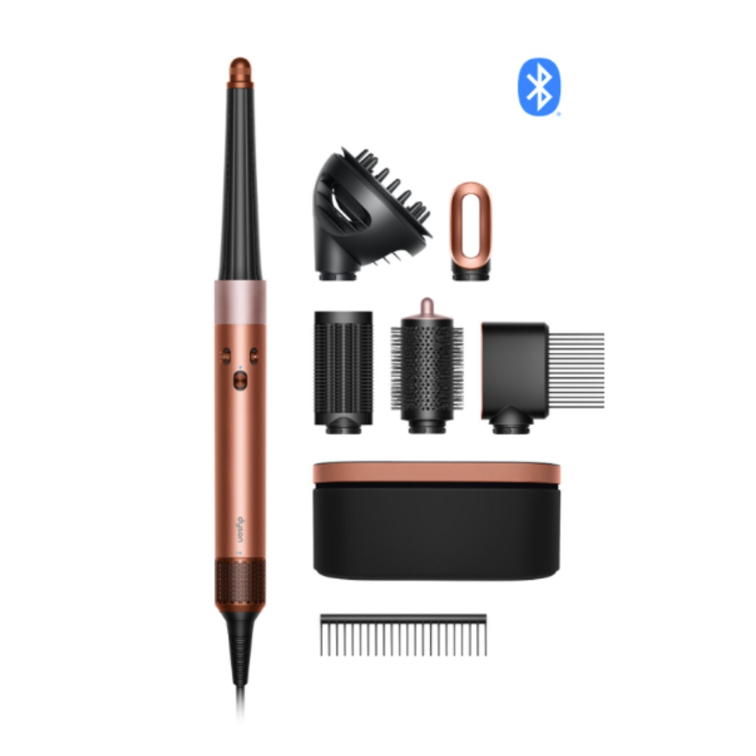 A product shot of the Dyson Airwrap i.d.&amp;trade; multi-styler and dryer Curly+Coily, with all its attachments and travel case, on a white background