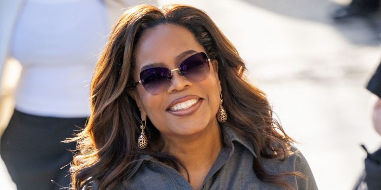 Oprah Winfrey wears ME+EM camel trousers and cerulean blouse