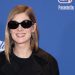 Rosamund Pike uses a contrast handbag to brighten her look