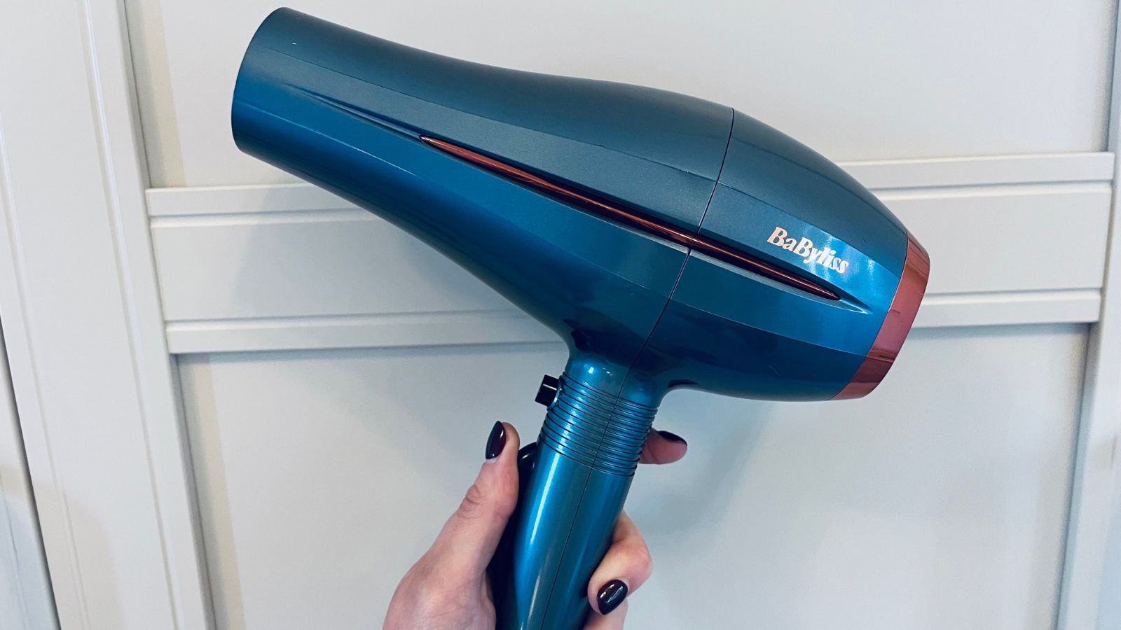image of hand holding BaByliss Denim Luxe Hairdryer