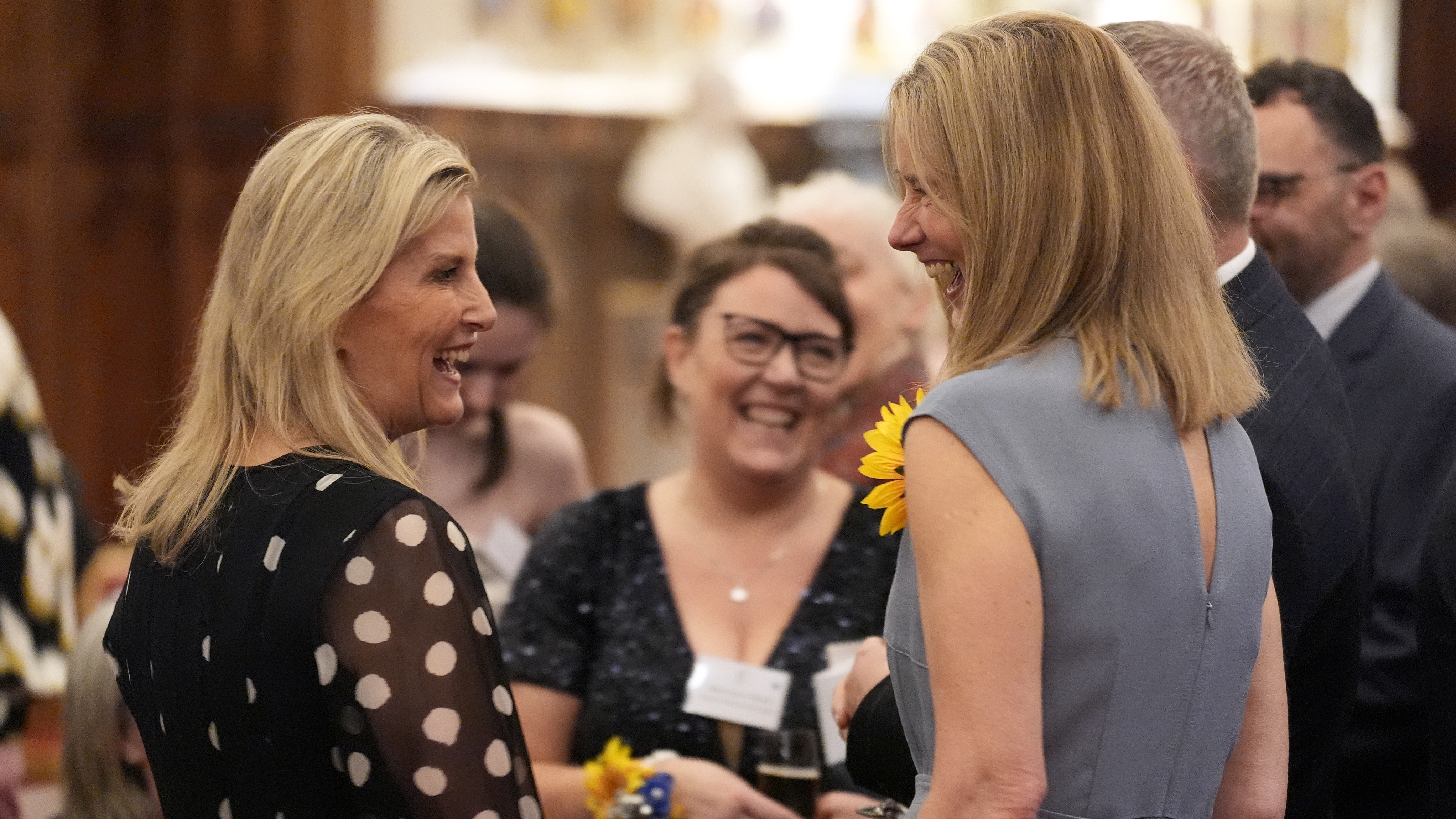 Sophie, Duchess of Edinburgh (left) speaks with guests during a reception to highlight the inspirational work of paid and unpaid carers